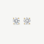 Pair of diamond stud earrings on a white background