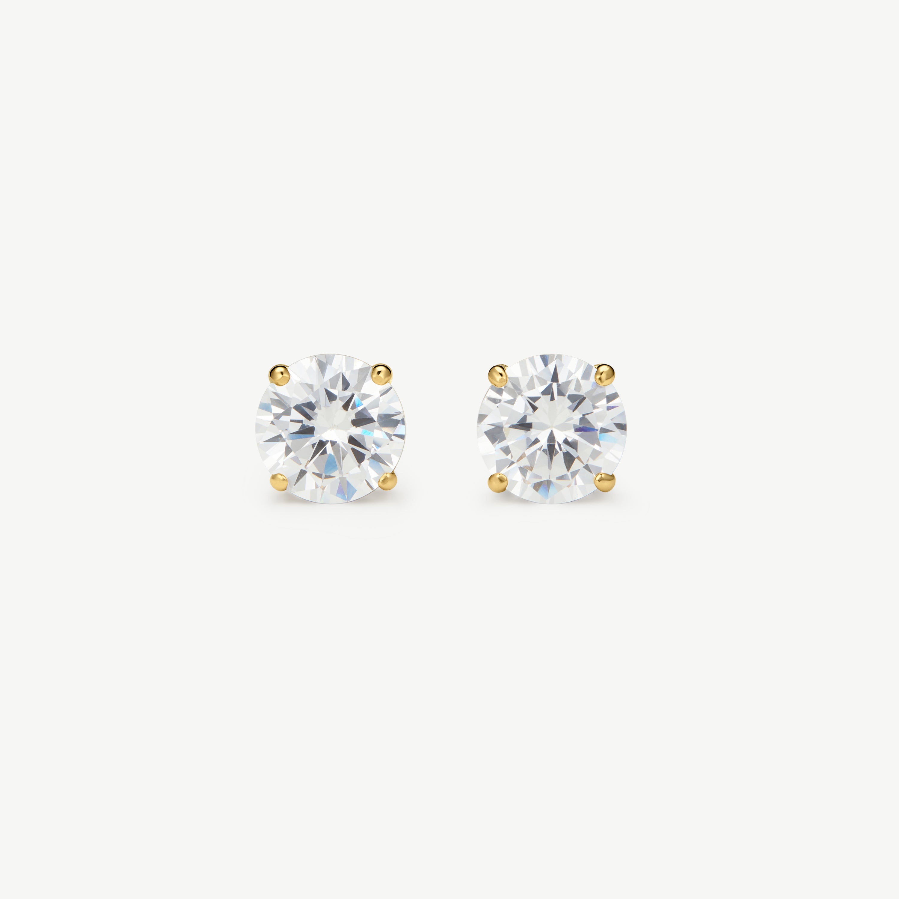 Pair of diamond stud earrings on a white background